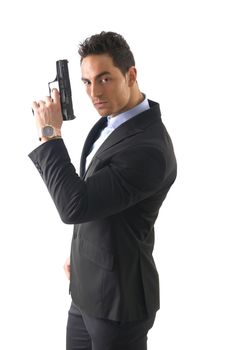 Elegant man with gun, dressed as a spy or secret agent, with earphones, isolated on white