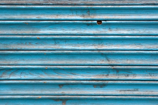 Dirty, stained by a paint the hammered together fence