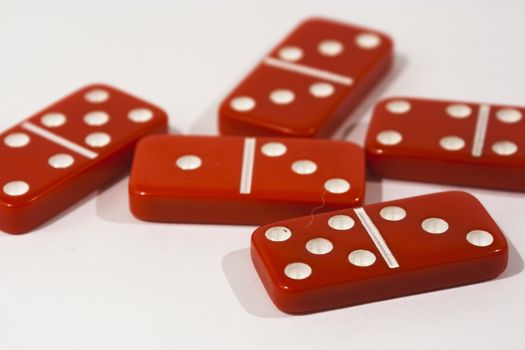 Red dominoes on a white background