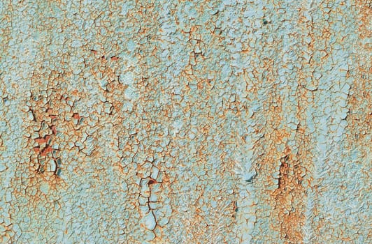 texture of old green peeling paint on metal wall