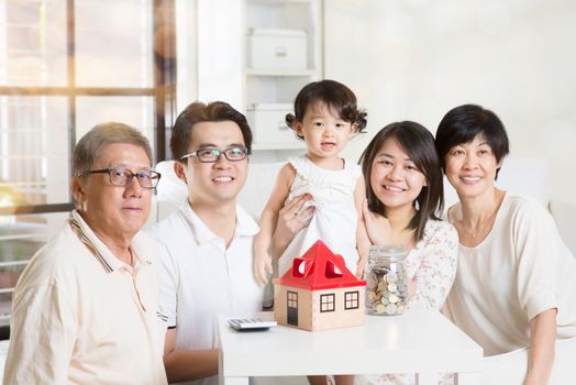 Family future investment or financial planning concept. Asian multi generations lifestyle at home.
