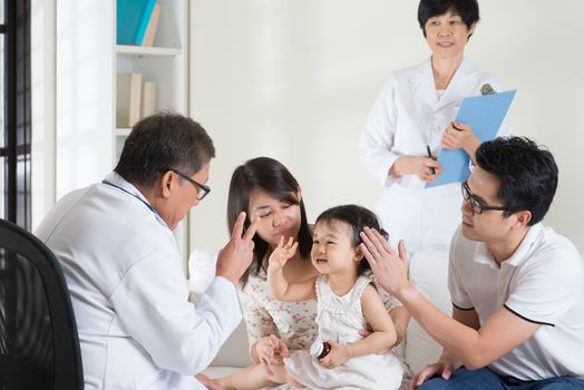 Family consult pediatrician. Doctor and patient healthcare concept.