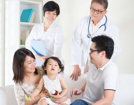 Toddler cries after consult family doctor. Pediatrician and patient healthcare concept.