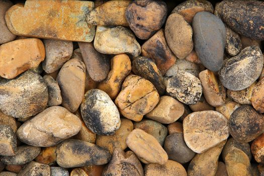 Pile of round pebble stones for background