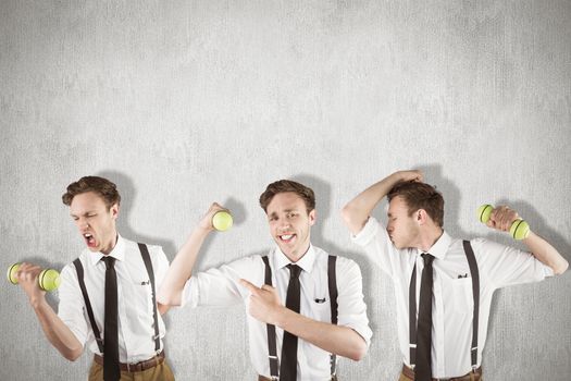 Nerd with dumbbell against white and grey background