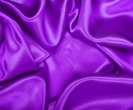 Smooth elegant lilac silk or satin texture can use as background 