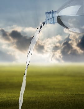 Pouring water against the nature background, Freshness concept