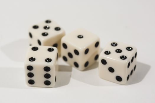 White dice shot against a white background