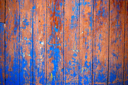 Dirty, stained by a paint the hammered together fence