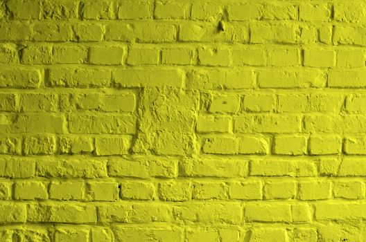 Background of Brick Wall Painted with Mortar Yellow Lemon Color closeup