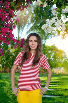 beautiful sensuality young girl on a background of flowers.