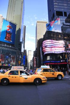 New York, NY, USA - May 16, 2013: Times Square, featured with Broadway Theaters and huge number of LED signs, is a symbol of New York City and the United States, May 16, 2013 in Manhattan, New York City