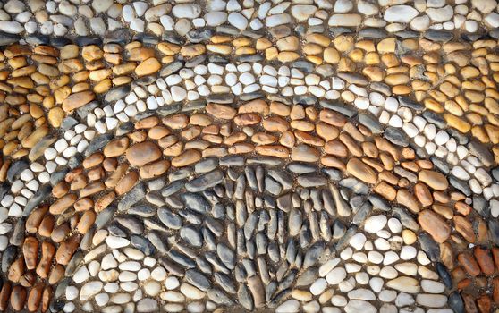 Beautiful ornament from stones on the ground.