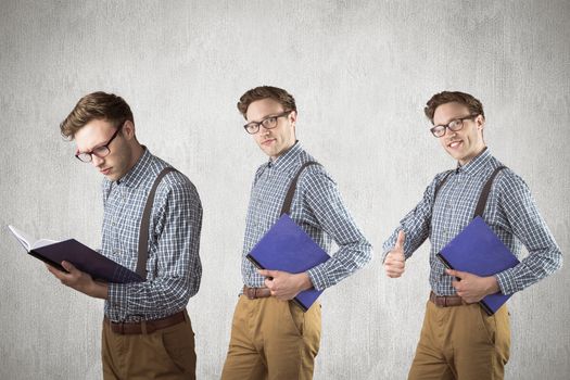 Nerd with notebook against white and grey background