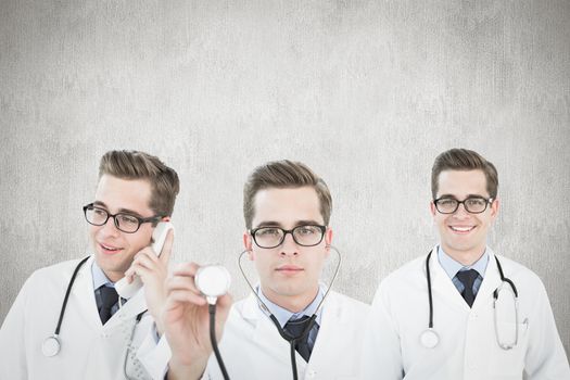 Young doctor against white and grey background