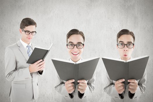 Nerd reading book against white and grey background