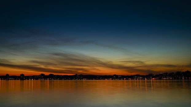 Sunset over Kempenfelt Bay and the City of Barrie Ontario skyline.