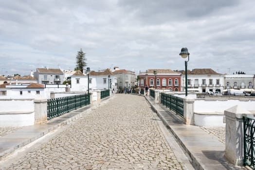 TAVIRA,PORTUGAL-APRIL17, 2015: view on the old houses and bridge of the old town Tavira in the south of Portugal on April 17 2015,This town is one of the oldest towns in Portugal in the Algarve