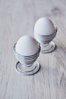 Two easter eggs on white background table