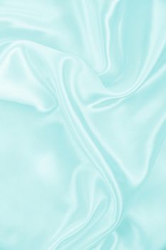 Smooth elegant blue silk or satin texture can use as background 