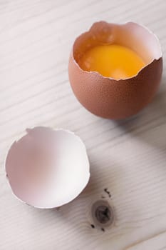 open egg resting on a wooden base