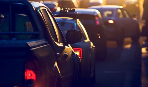 Urban traffic jam at the evening, sunlight