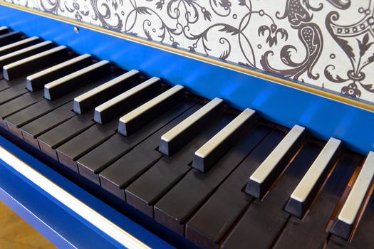 Detail of old harpsichord keyboard with black keys, close-up view