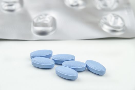 Blue tablets isolated on white background