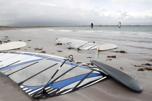 wind surfers braving the storm winds on the wild atlantic way in county Kerry Ireland