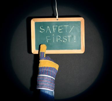 a finger pointing plate bearing the inscription "safety first"