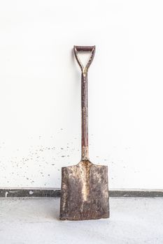 old dirty shovel isolated on a white background