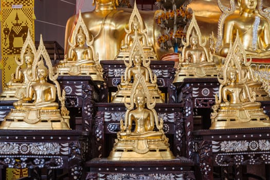 Golden Buddha statue names Buddhachinaraj sit on layer respectively, the most beautiful buddha image of Thailand,can use religious concept background