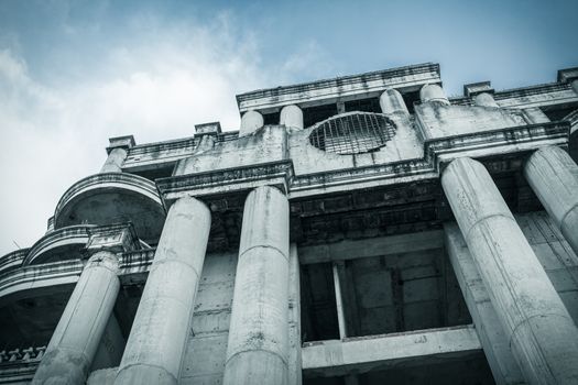 abandoned building can use horror movie scene background, low angle shot