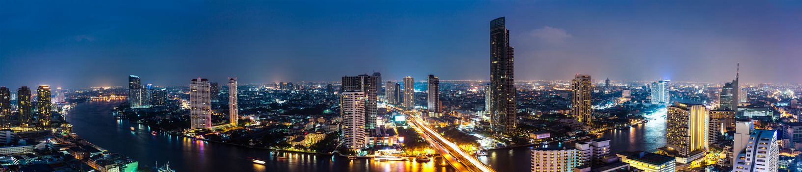 Business Building Bangkok city area at night life with transportation car and ship as panorama, high angle bird eyes view