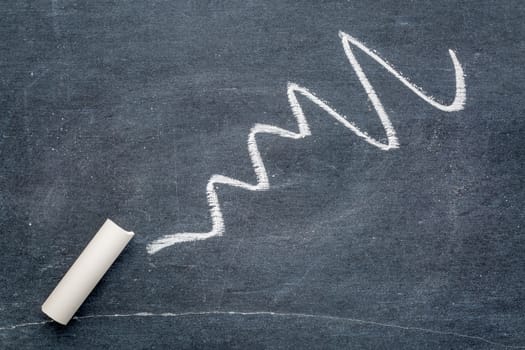 white chalk abstract on vintage slate blackboard