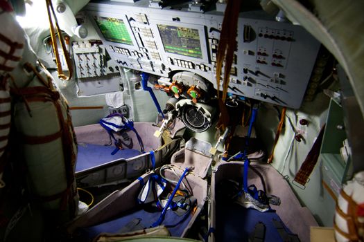Inside controls panel of Russian Soyuz space module with three seats