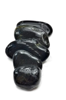 Stack of black stones indicate the concept of balance