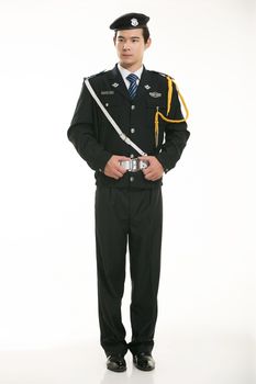 Create all kinds of work clothes policeman stands in front of a white background