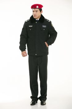 Create all kinds of work clothes policeman stands in front of a white background