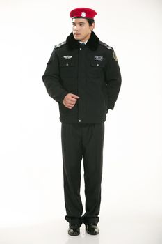 Create all kinds of work clothes policeman stands in front of a white background