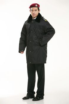 Create all kinds of work clothes policeman stands in front of a white background