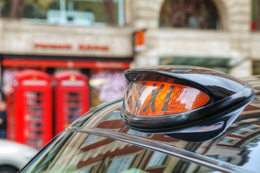 Famous taxi cab (hackney) on a street in London, UK