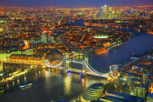 Aerial overview of London city with the Tower bridge at the night time