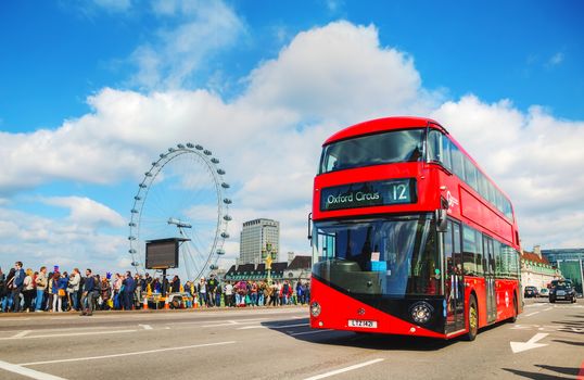 LONDON - APRIL 5: Iconic red double decker bus on April 5, 2015 in London, UK. The London Bus is one of London's principal icons, the archetypal red rear-entrance Routemaster recognised worldwide.