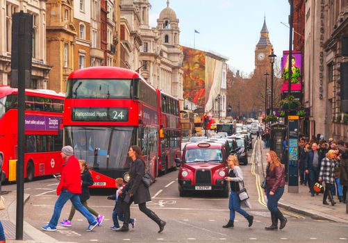 LONDON - APRIL 5: Iconic red double decker bus on April 5, 2015 in London, UK. The London Bus is one of London's principal icons, the archetypal red rear-entrance Routemaster recognised worldwide.