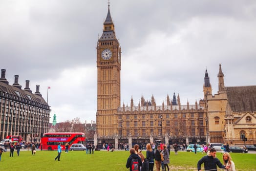LONDON - APRIL 4: Parliament square with people in city of Westminster on April 4, 2015 in London, UK. It's a square at the northwest end of the Palace of Westminster in London.