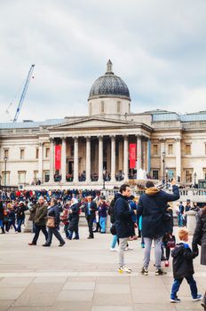LONDON - APRIL 5: National Gallery building at Trafalgar square on April 5, 2015 in London, UK. Founded in 1824, it houses a collection of over 2,300 paintings dating from the mid-13th century to 1900.