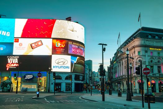 LONDON - APRIL 12: Piccadilly Circus junction early in the morning on April 12, 2015 in London, UK. It's a road junction and public space of London's West End in the City of Westminster, built in 1819.