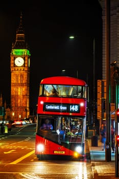 LONDON - APRIL 14: Iconic red double decker bus on April 14, 2015 in London, UK. The London Bus is one of London's principal icons, the archetypal red rear-entrance Routemaster recognised worldwide.
