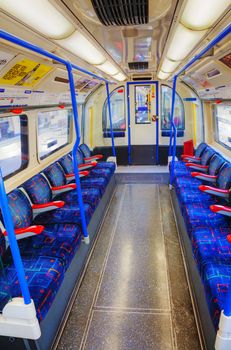 LONDON - APRIL 15: Interior of the underground train car on April 15, 2015 in London, UK. The system serves 270 stations and has 402 kilometres of track, 52% of which is above ground.